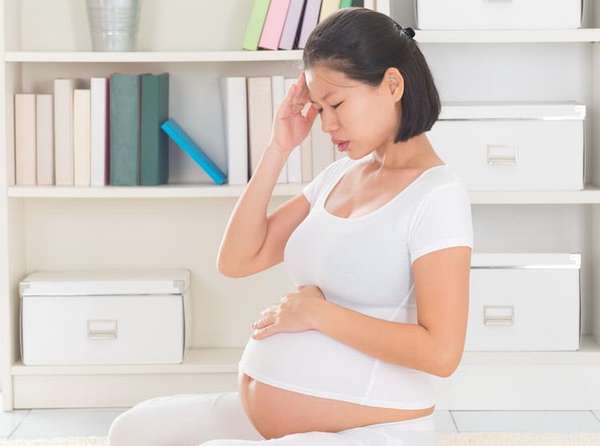 Что делать если болит голова при беременности